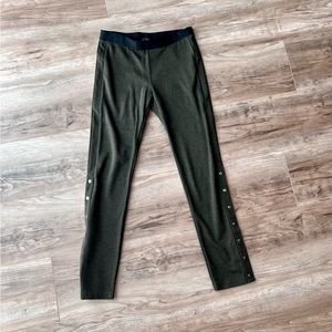 BCBGmaxazria green leggings with black waistband buttons up side ankle hem large